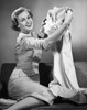Portrait of a young woman holding a dress Poster Print - Item # VARSAL25541985