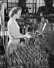 Side profile of a mid adult woman working on a winding machine Poster Print - Item # VARSAL25536694