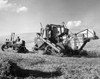 Farmer using a combine harvester in a pea field  Washington State  USA Poster Print - Item # VARSAL25530496
