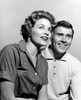 Studio portrait of mid adult couple smiling Poster Print - Item # VARSAL25549105