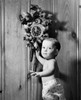 Portrait of a baby boy standing near a cuckoo clock Poster Print - Item # VARSAL25526758A
