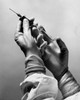 Surgeon's hands holding a syringe Poster Print - Item # VARSAL25515371