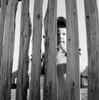 Girl looking through fence Poster Print - Item # VARSAL255424545