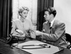 Young woman and young man at doctor's office Poster Print - Item # VARSAL255417972
