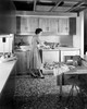 Young woman working in a kitchen Poster Print - Item # VARSAL25531902