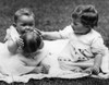 Two baby girls sitting on blanket and playing with ball Poster Print - Item # VARSAL990359109