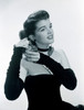 Young woman spraying hair with perfume Poster Print - Item # VARSAL255417233