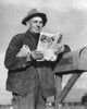 Man checking mailbox and reading magazine Poster Print - Item # VARSAL25549064