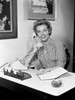 Portrait of young woman using telephone in office Poster Print - Item # VARSAL255416854