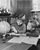 Two children sitting and looking at a globe Poster Print - Item # VARSAL25516403