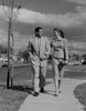 Mid adult couple walking Poster Print - Item # VARSAL255422110