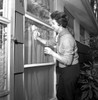 Woman cleaning window Poster Print - Item # VARSAL25549261