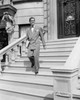Young man walking down steps Poster Print - Item # VARSAL255417964