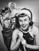 Portrait of a young woman carrying a sack of Christmas presents on her back Poster Print - Item # VARSAL25516085A