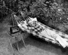 Man relaxing in hammock listening to radio Poster Print - Item # VARSAL25549044