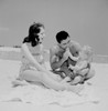 Family with baby boy on beach Poster Print - Item # VARSAL255421711
