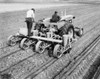 Two farmers plowing a field with four row cotton planters Poster Print - Item # VARSAL25530440