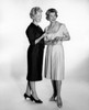Studio shot of two women talking Poster Print - Item # VARSAL25549098