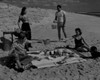 Young couples having picnic on beach Poster Print - Item # VARSAL255422755