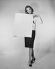 Young woman holding a blank placard Poster Print - Item # VARSAL25541945