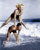 Young couple playing leapfrog in surf Poster Print - Item # VARSAL2558784A