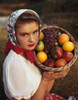 Portrait of a young woman holding a basket of fruit Poster Print - Item # VARSAL31072910