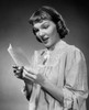 Close-up of a young woman reading a letter Poster Print - Item # VARSAL25541785
