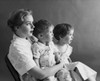 Mid adult woman sitting with her two children Poster Print - Item # VARSAL2551409C