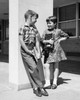 Boy and girl carrying books and talking to each other Poster Print - Item # VARSAL2553487A