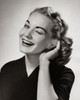 Portrait of a young woman cupping her ear to hear Poster Print - Item # VARSAL25510498