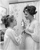 Mother about to spray perfume on her daughter Poster Print - Item # VARSAL25527168