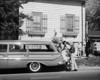 Parents and their children loading luggage into a car Poster Print - Item # VARSAL25517860