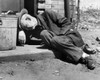Homeless senior man sleeping near a garbage can Poster Print - Item # VARSAL2553764