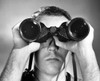 Close-up of a young man looking through binoculars Poster Print - Item # VARSAL25542715