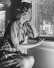 Side profile of a young woman looking through a window Poster Print - Item # VARSAL25525066