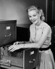 Portrait of a businesswoman searching for files in a filing cabinet Poster Print - Item # VARSAL2557136