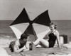 Young couple relaxing on the beach Poster Print - Item # VARSAL2558561