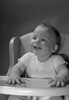 Baby sitting in high chair smiling Poster Print - Item # VARSAL2559699