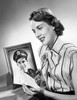 Close-up of a young woman reading a letter Poster Print - Item # VARSAL2552931
