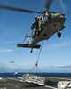 Pacific Ocean, August 7, 2011 - An MH-60S Sea Hawk helicopter lowers cargo onto the deck of the Nimitz-class aircraft carrier USS John C. Stennis. Poster Print - Item # VARPSTSTK104772M