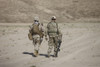 U.S. Marine and German Coalition soldier walk in a wadi near Kunduz, Afghanistan Poster Print - Item # VARPSTTMO100321M