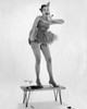 Young woman dancing on a table Poster Print - Item # VARSAL2554729