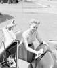 Young woman cleaning seats in car Poster Print - Item # VARSAL255424890