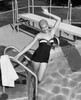 Portrait of young woman smiling in swimming pool Poster Print - Item # VARSAL2557271A
