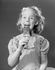 Studio portrait of girl eating popsicle Poster Print - Item # VARSAL255421849