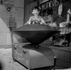 Boy in toy ride outside store Poster Print - Item # VARSAL255417560