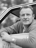 Portrait of mature man looking through car window Poster Print - Item # VARSAL25549038