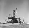 1965 - Overall view of the Gemini-Titan 3 on Launch Pad 19, Cape Canaveral, Florida. The GT-3 liftoff was on March 23, 1965. A photographer stands at bottom of launch pad with a movie camera. Poster Print - Item # VARPSTSTK203911S