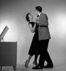 Couple dancing by jukebox Poster Print