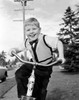 Boy riding bike smiling Poster Print - Item # VARSAL255424535